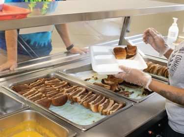 hands serving food 